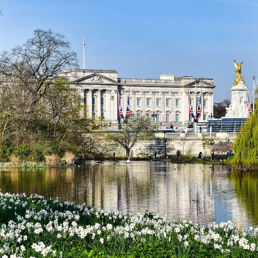 Buckingham Palace seen across the lake in St James’s Park in spring, a short walk from Mayfair