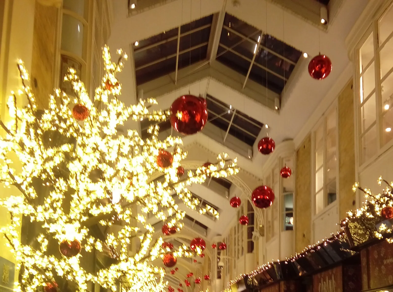 Burlington Arcade dressed for Christmas with a lit tree and red baubles